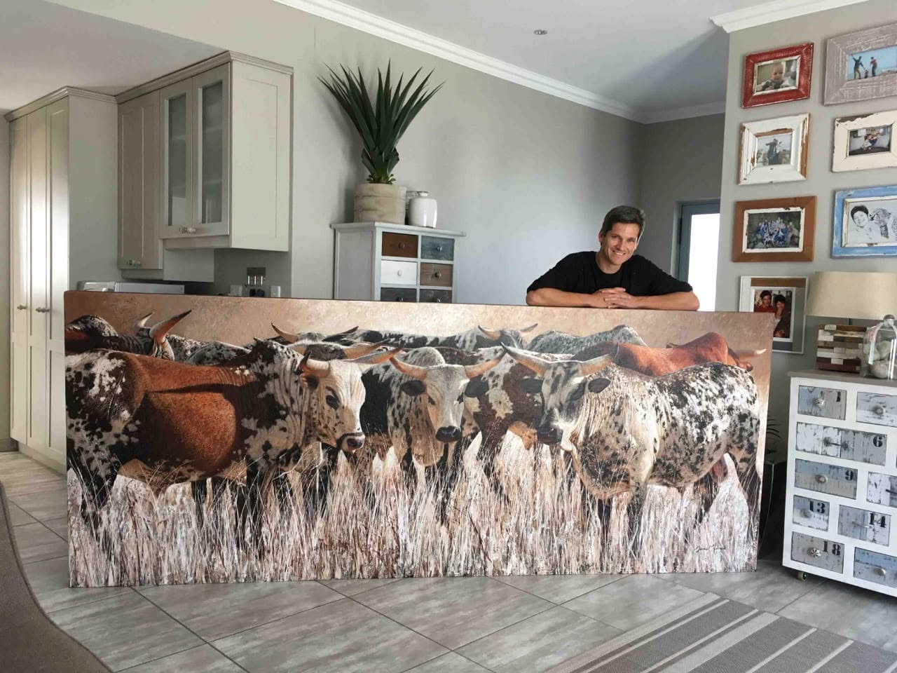 Danie Marais with a completed Nguni cattle canvas
